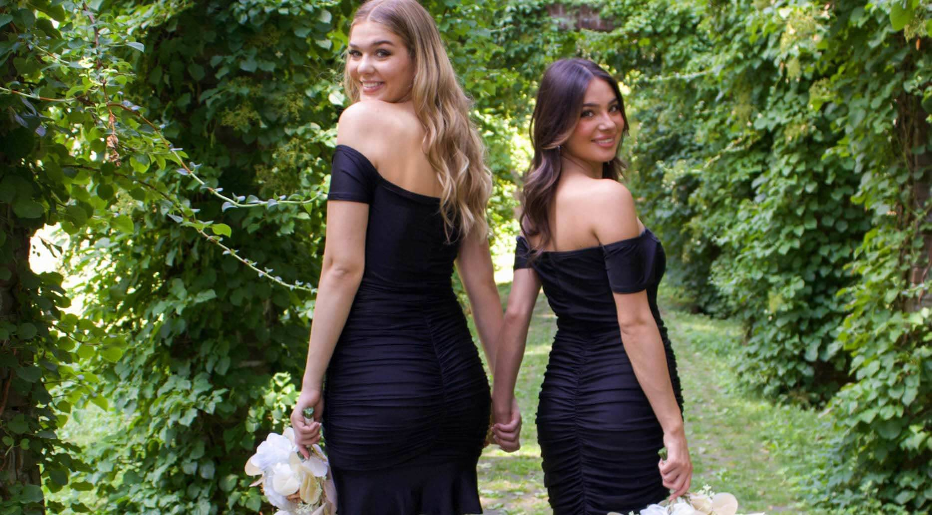 Models wearing a black dresses